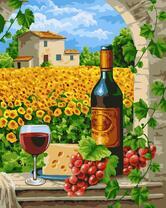 Вино и сыр на фоне цветущих подсолнухов